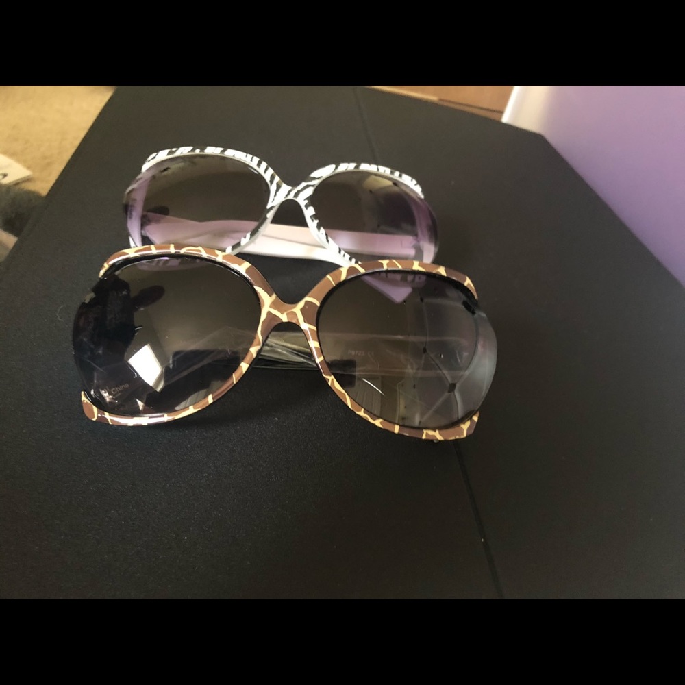 Two brand new pair of animal print sunglasses